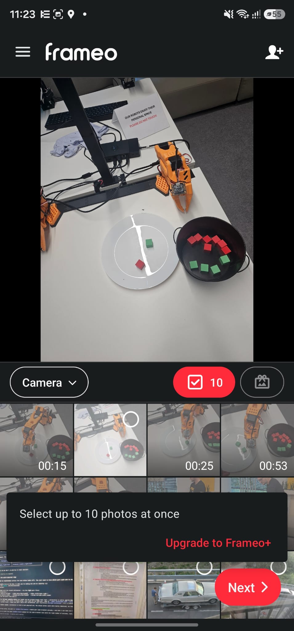 Frameo app photo picker with ten photos selected and a message reading: Select up to 10 photos at once. Upgrade to Frameo+.