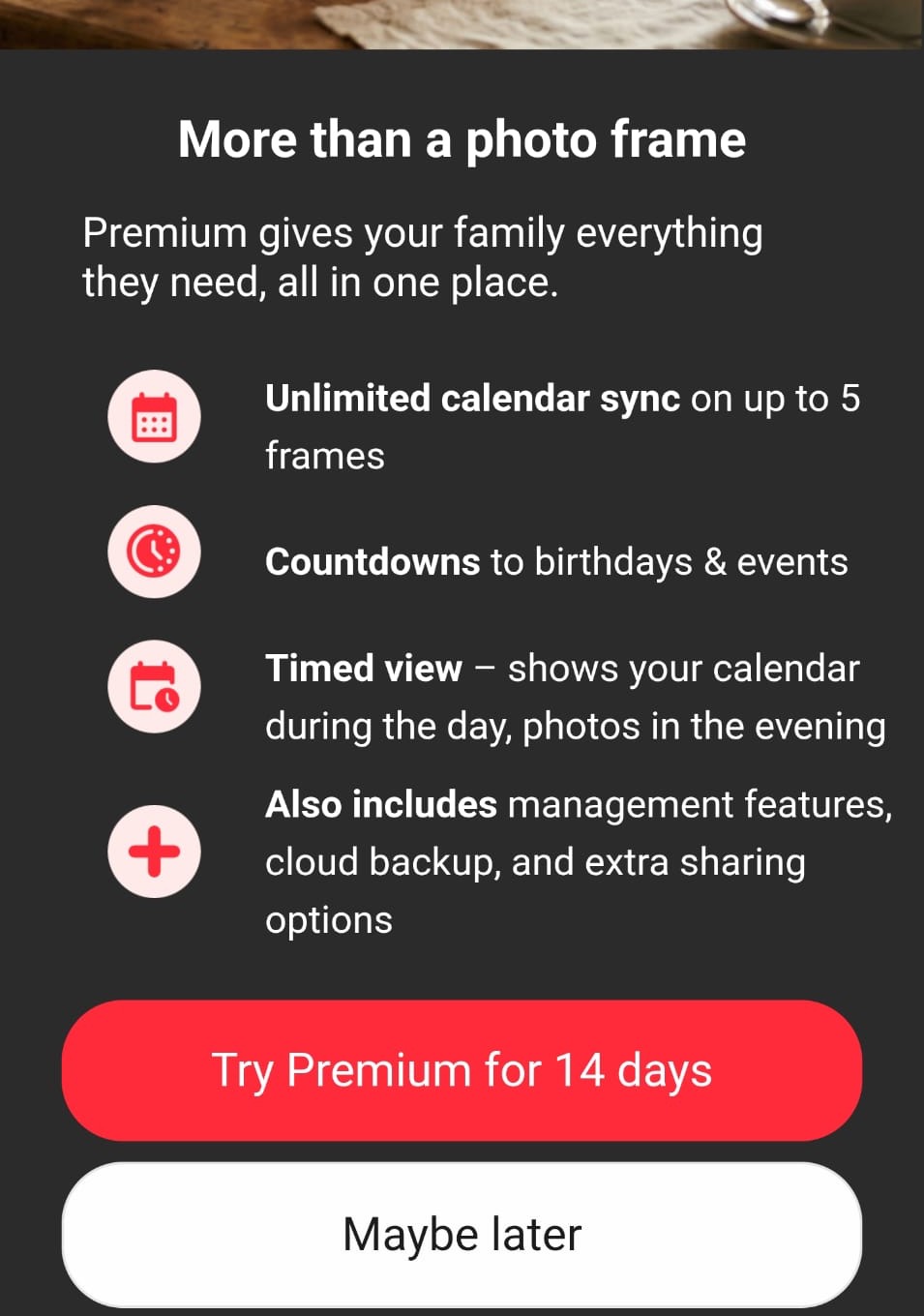 Frameo Premium screen reading: More than a photo frame, listing calendar sync, countdowns and timed view, with a Try Premium for 14 days button.
